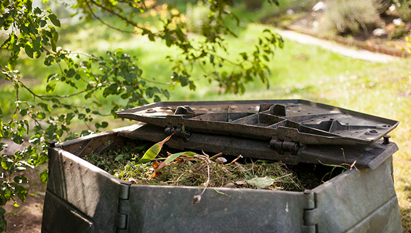 half open compost bin with waste in it
