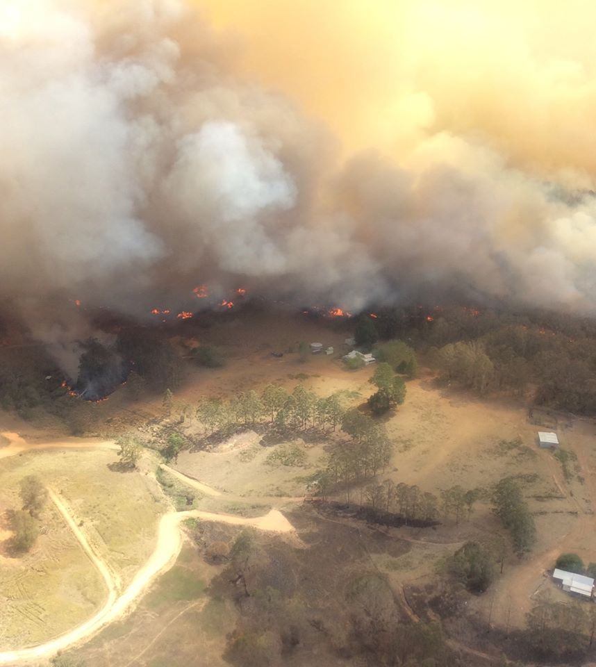 Aerial photo of fire and smoke in farmland