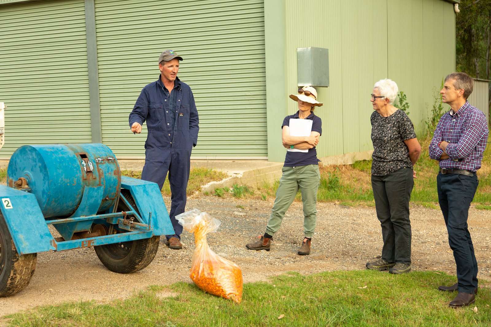 Biosecurity officer talks to landholders about group rabbit control