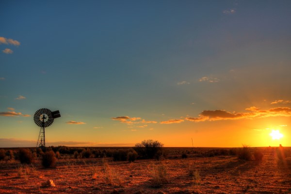 Windmill and sunset in remote outback