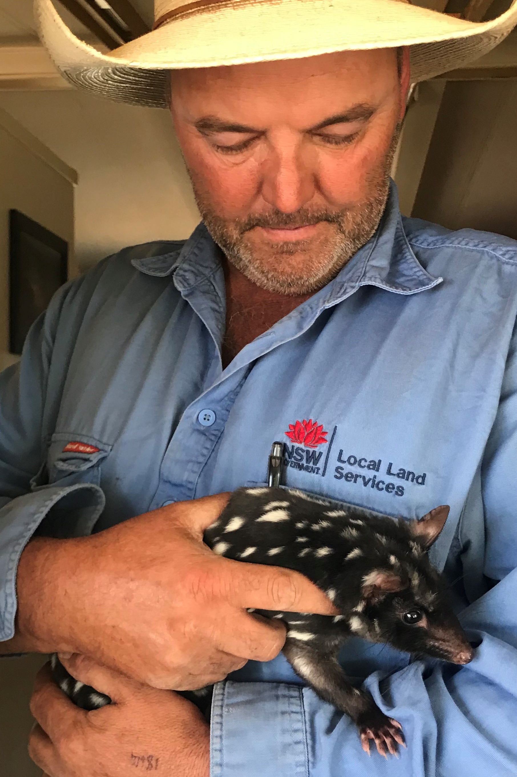Jonathan Randle holds an Eastern Quoll